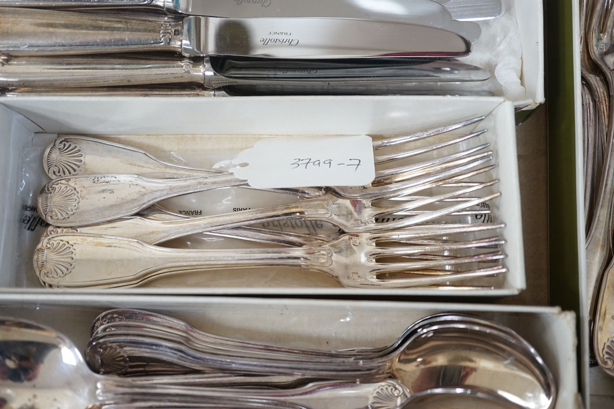 A Chistofle plated canteen of fiddle and shell pattern cutlery